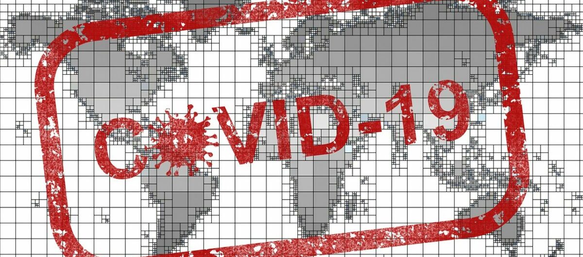 Covid 19 Stempel auf Weltkarte